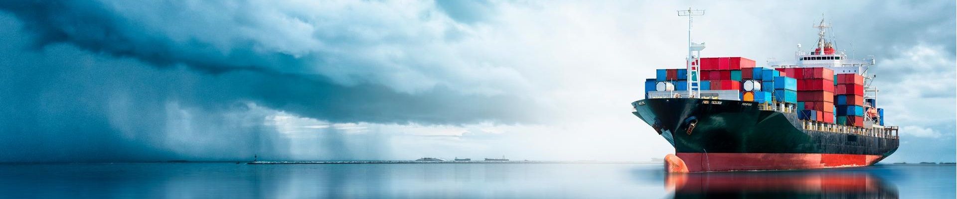container cargo ship at sea - 1920 x 400
