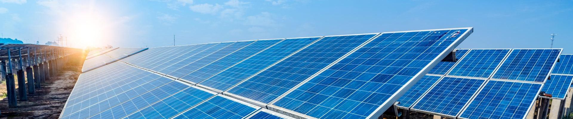 Solar energy panels and wind turbine, clean energy background