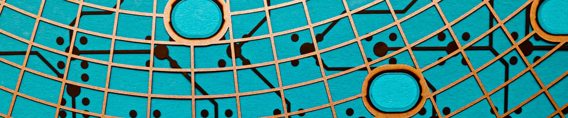 Circuit board made of plastic with circuit traces on blue background