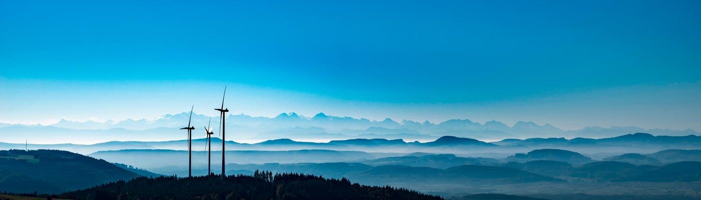 Wind turbines swiss alps 1400x400