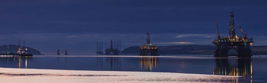 Oilrigs against blue skyline
