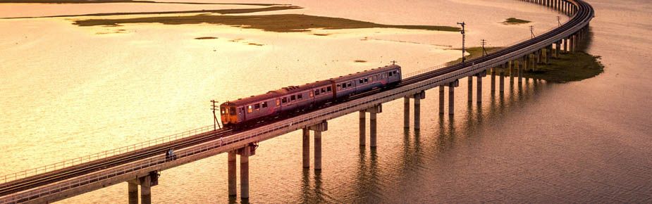 Image of train going over a viaduct at dusk
