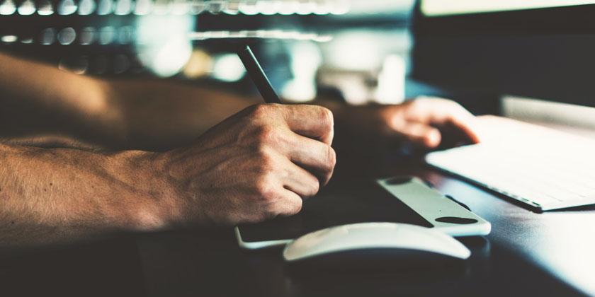 man drawing using a tablet pc
