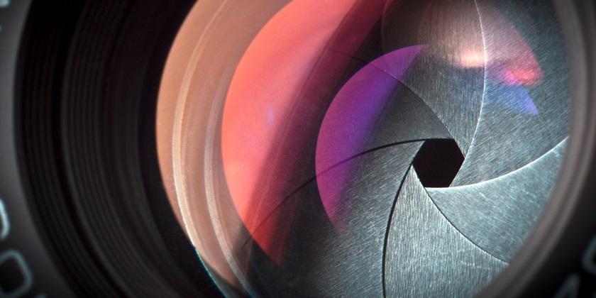 Camera lens with purple glare 840x420
