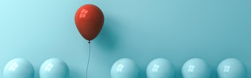 Red balloon pops up among cyan balloons_925x290.jpg
