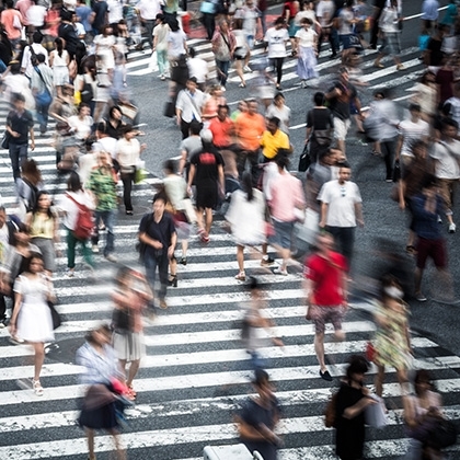 crowd crossing crosswalk in tokyo