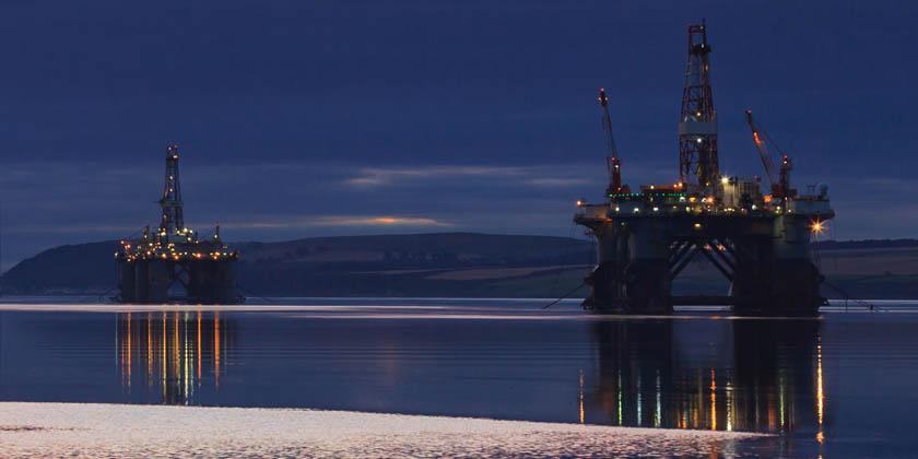 Oilrig against blue skyline