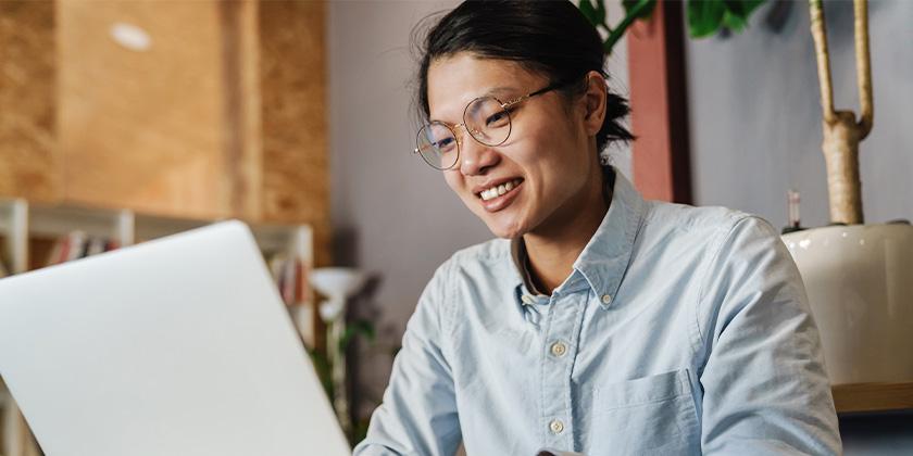 studying with laptop while sitting at table 840x420.jpg