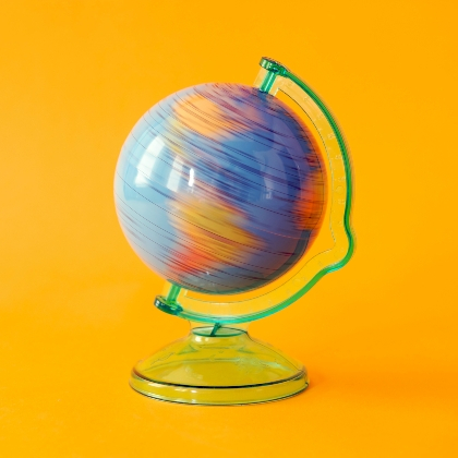 Spinning globe on yellow background