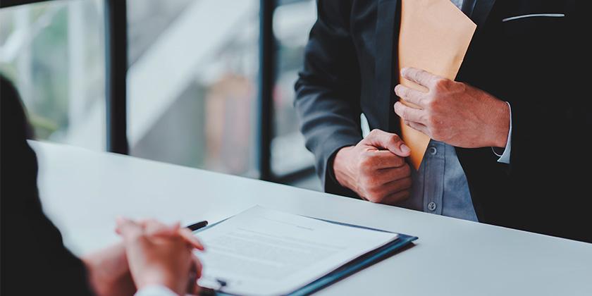 Bribery and corruption concept 840x420.jpg