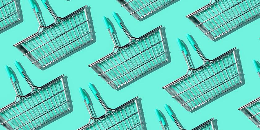 shopping baskets on green background