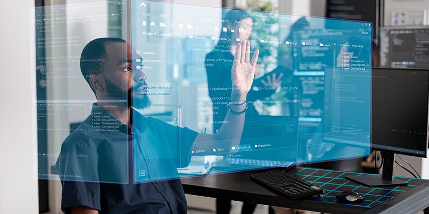 African American programmer working with hologram 840x420.jpg