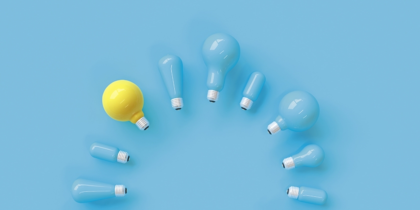 yellow and blue lightbulbs arranged in a circle on a blue background