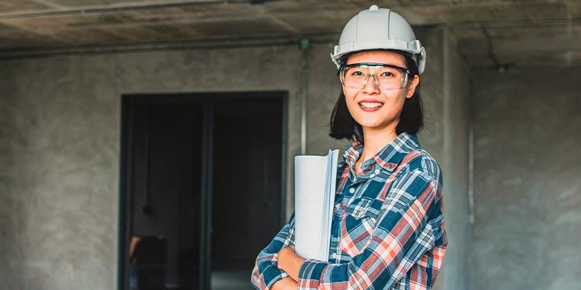 women holding blueprint at construction site 840x420.jpg