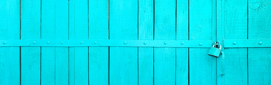 padlock hanging from turquoise painted wooden doors 925
