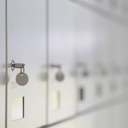macro of safe deposit lockboxes with hanging keys