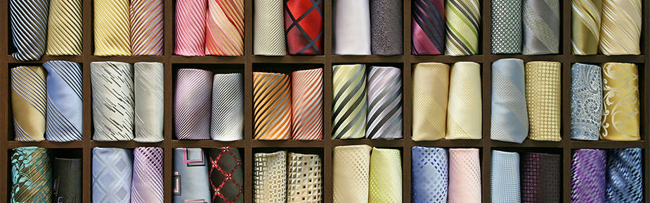 Rolled up neck ties on shelves