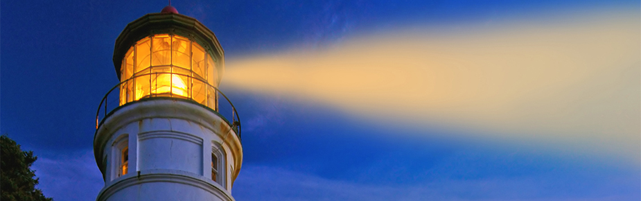 Lighthouse at night shining its light