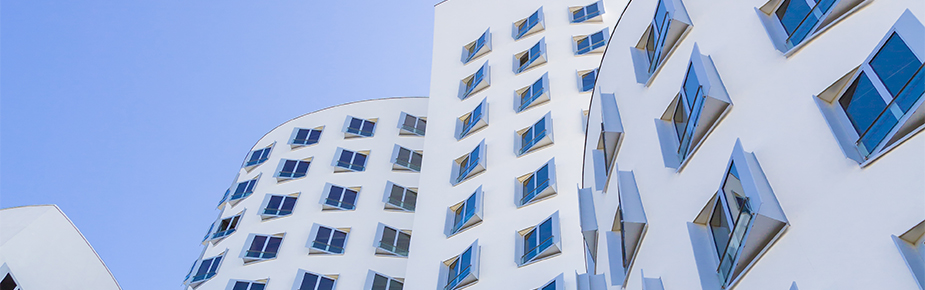 white buildings with angled windows