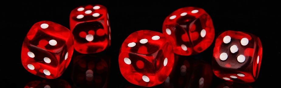 Red gaming dice on black background