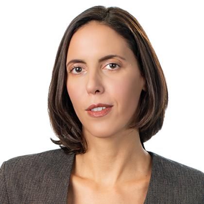 Ksenija Boreta portriat, brown shoulderlong hair and a grey,brown blazer