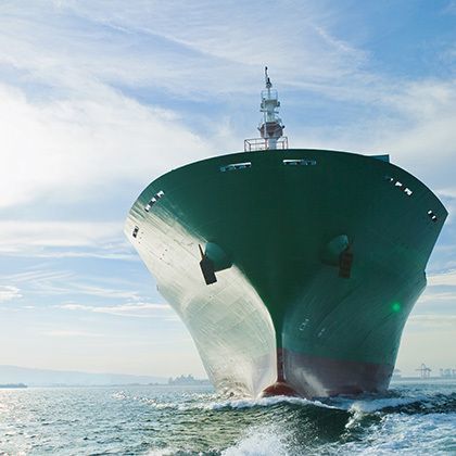 bow view of cargo ship sailing on ocean