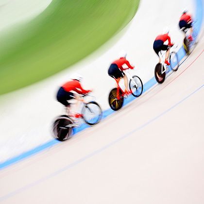 four cyclists on velodrome