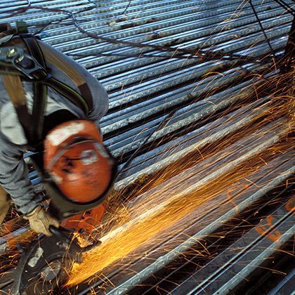 industrial worker welding on construction site