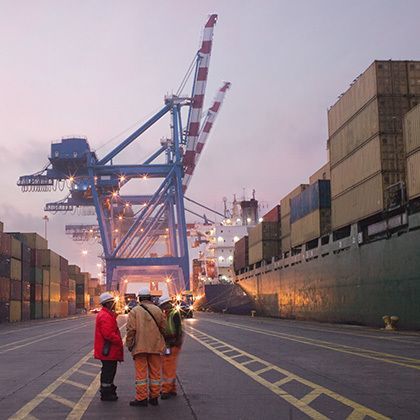 workers talking in a shipping yard