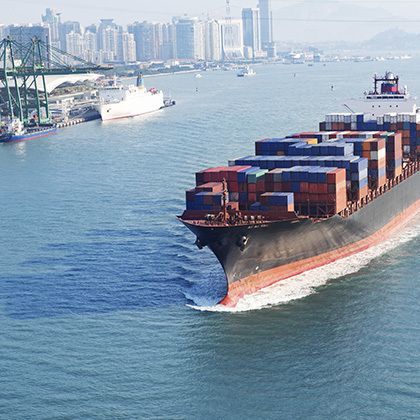 aerial view over a big container ship in the pacific ocean