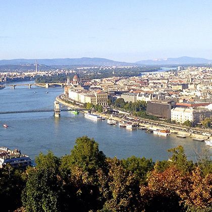 bird's eye angle view down to danube river over and the parliament building in budapest, hungary