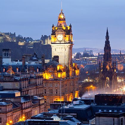 panoramic view of edinburgh skyline skyscrapers castle and monument from calton hill at dusk