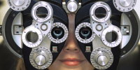 woman at eye exam clinic vision test