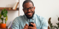 Man with a smartphone scrolling social media