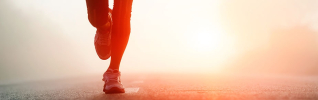 person running on road white line at sunrise