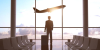 Businessman in airport and airplane in sky