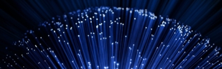 close up on the ends of many illuminated fiber optic strands