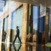 business people walking through the lobby of an office