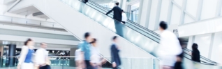 Blurred image of shoppers in a mall