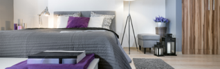 Hotel bedroom with grey and purple interior