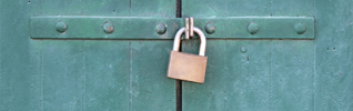 Green doors locked with gold padlock