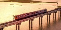 Image of train going over a viaduct at dusk