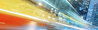 Long exposure shot of blurred bus speeding through night street