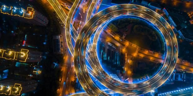 a big road in china, night time, cars on the road