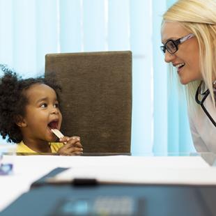 little girl with female doctor