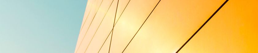 gold facade against sky 1920x400.jpg