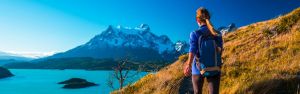 Woman hiker walks on the trail in the Torres del Paine National Park. Chile